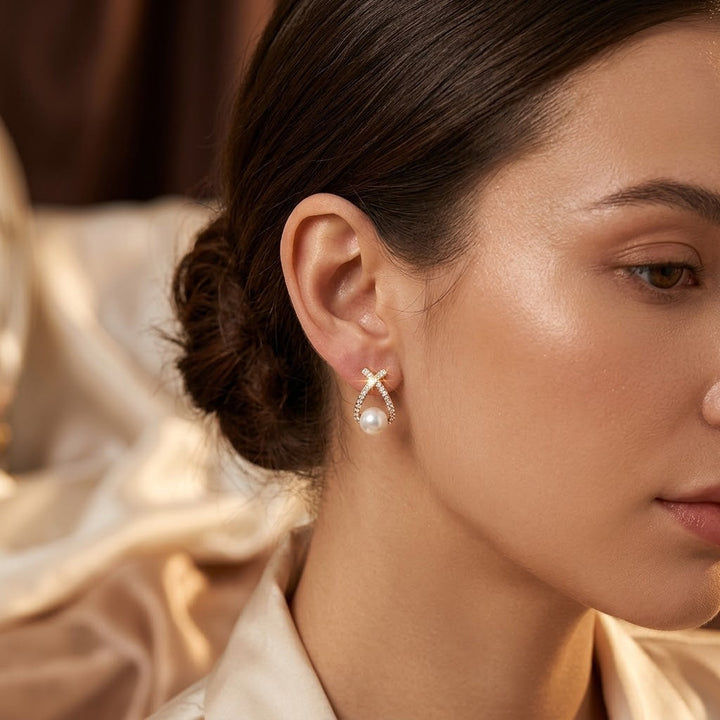 Gold Crisscross Pearl Stud Earrings by Harrison & James - earrings product image 1