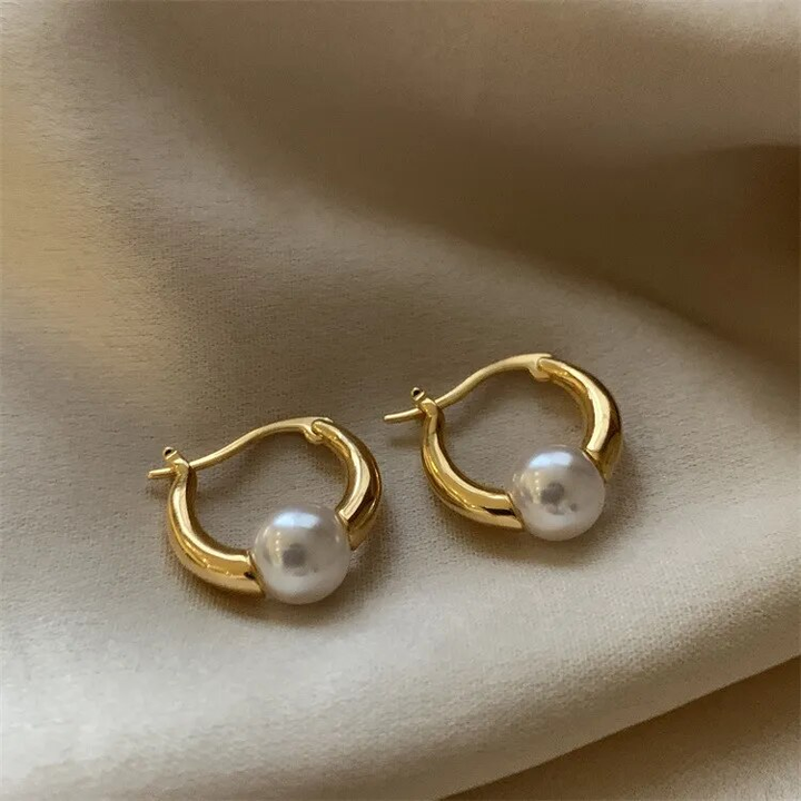 Elegant golden pearl earrings by Harrison & James - earrings product image 1