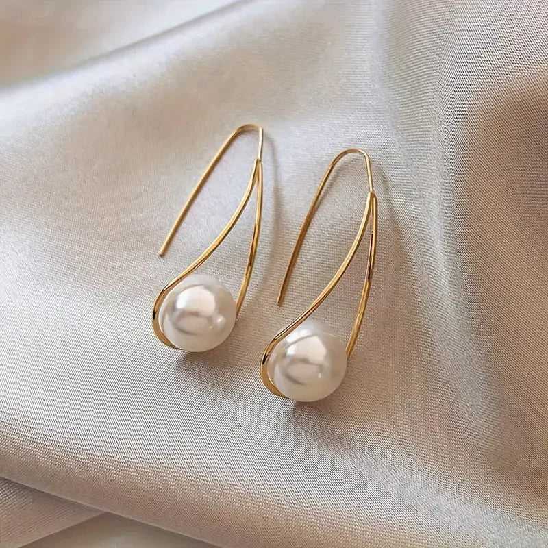 Elegant Pearl Dangling Earrings | Gold by Harrison & James - earrings product image 1